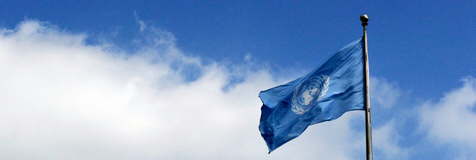 The United Nations flag flies against a blue sky on the opening day of the general debate of the sixty-fifth General Assembly.